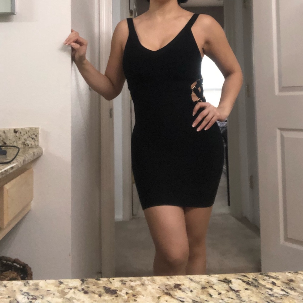 BEBE sleeve less bandage dress,never wornlength 30